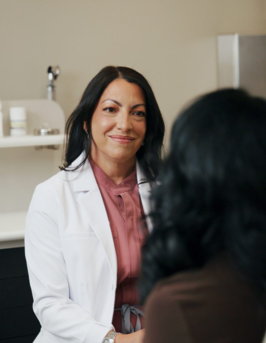 Dr. Vega speaking with a patient